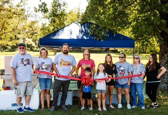 Between the Bunz Ribbon Cutting 2024